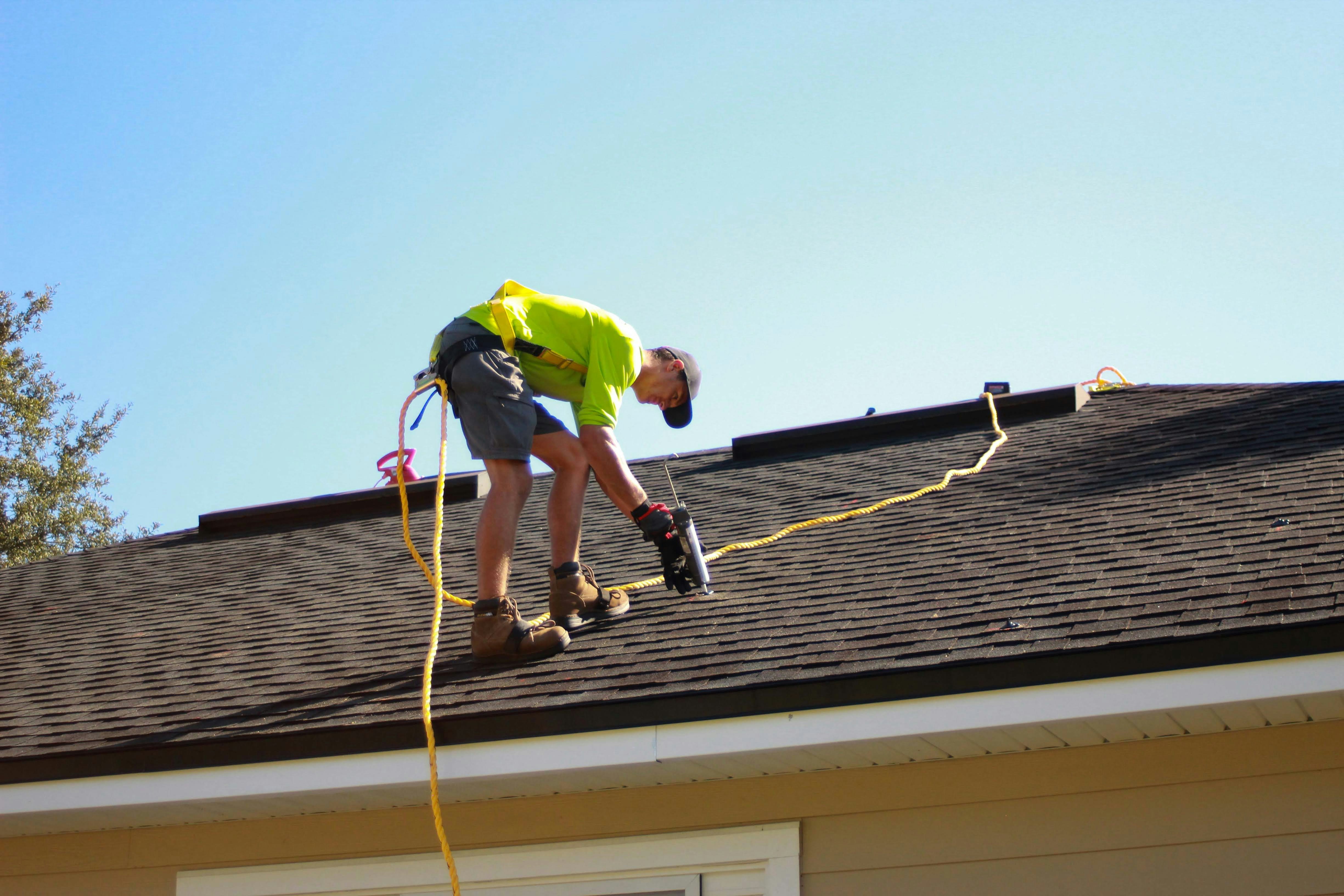 Roofing contractor at work